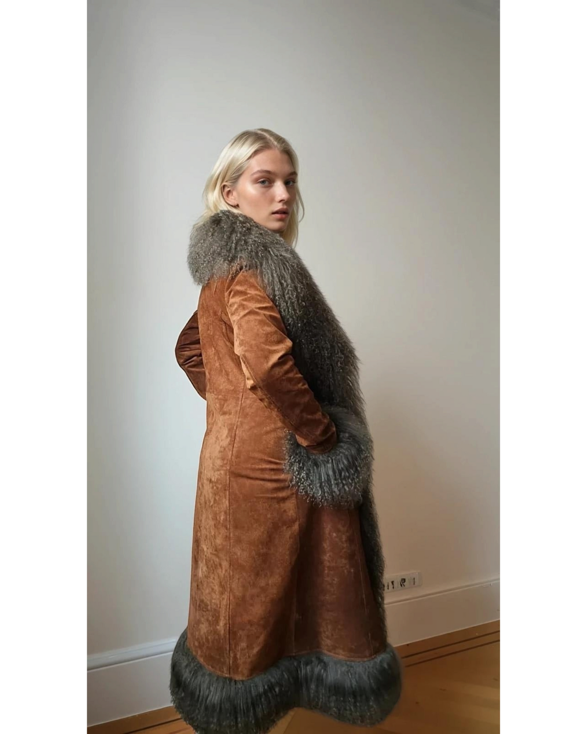 Reihana coat by Aql&Nafs in brown suede with Mongolian shearling at collar, cuffs and hem