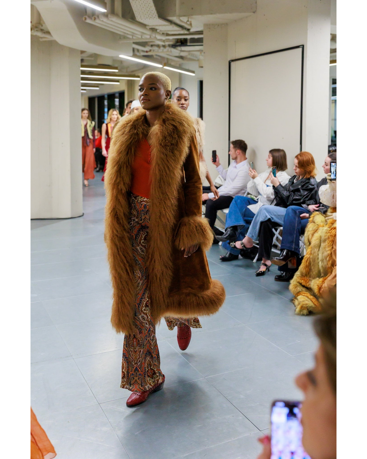 Amira coat by Aql&Nafs in brown suede with Mongolian shearling at collar, cuffs and hem