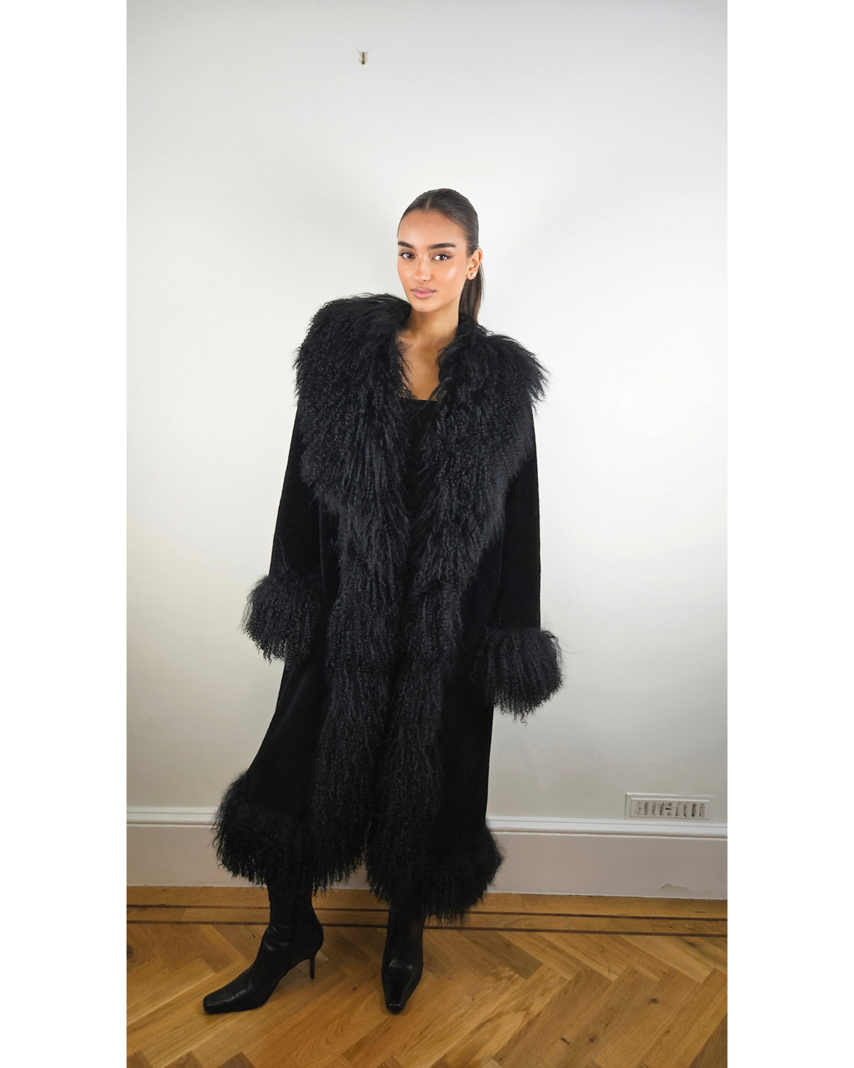 Rabia black teddy coat by Aql&Nafs with long Mongolian shearling trim