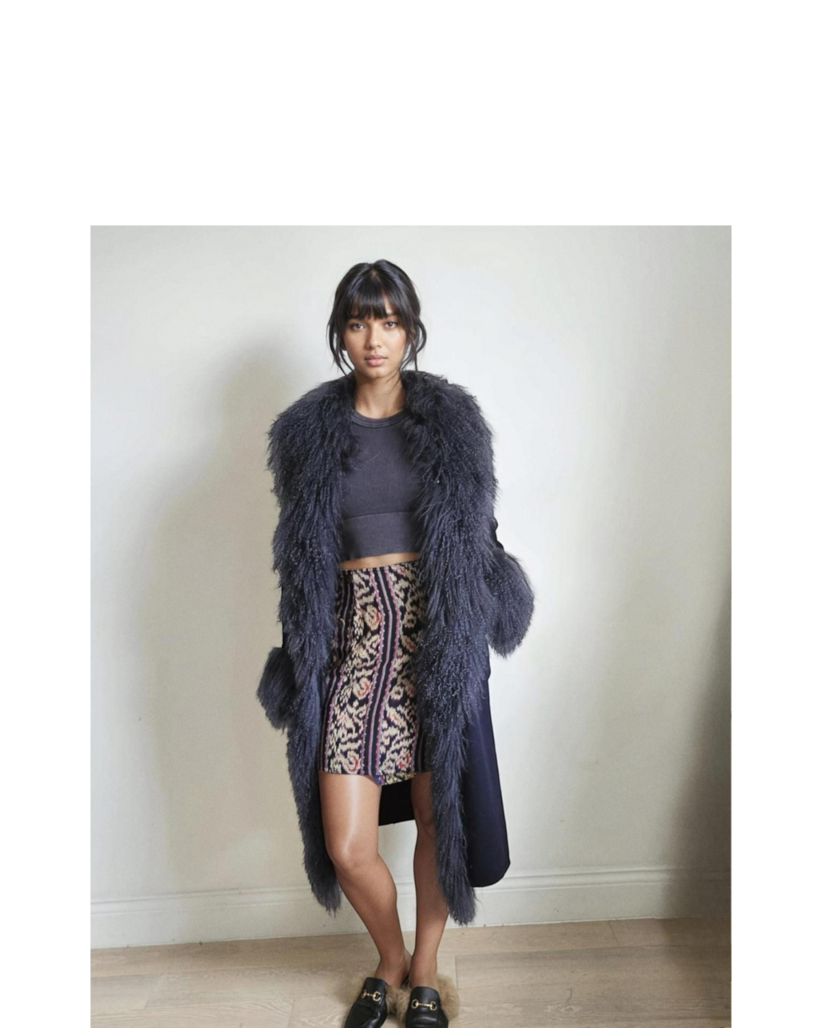 Touba coat by Aql&Nafs in navy cashmere-wool with Mongolian shearling at collar and cuffs