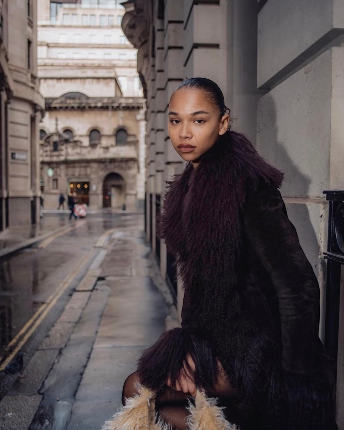 Irama coat by Aql&Nafs in dark brown suede with Mongolian shearling at collar, cuffs and hem