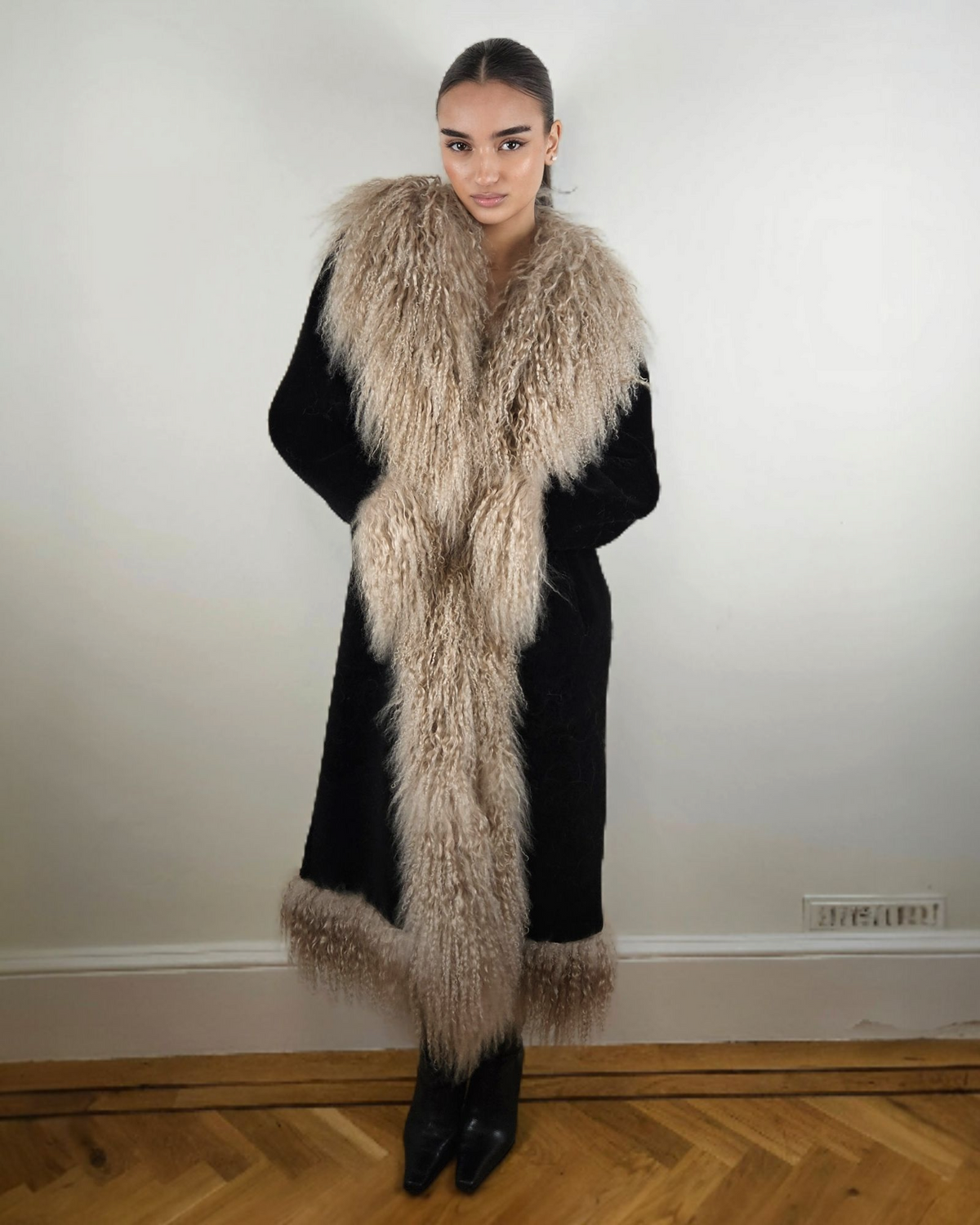 Alma coat by Aql&Nafs in black suede with beige Mongolian shearling in traditional Afghan style