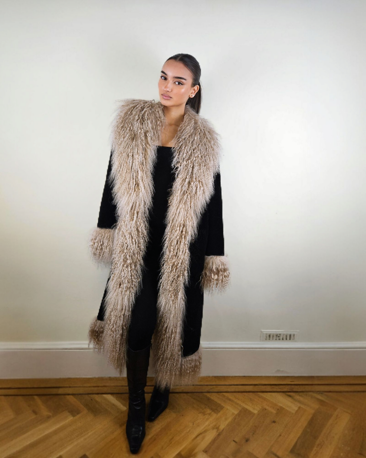Alma coat by Aql&Nafs in black suede with beige Mongolian shearling in traditional Afghan style